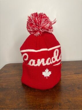 Canada Red Pom Beanie with White Maple Leaf